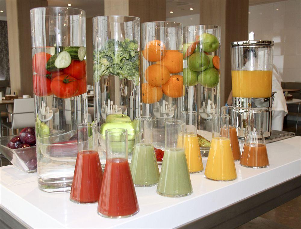 Nh Collection Madrid Palacio De Tepa Kültér fotó A selection of fruit juices